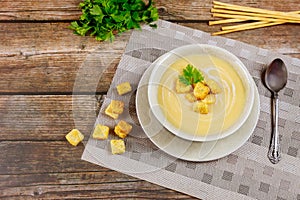 Mushroom creamy soup with croutons and italian bread sticks