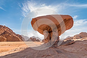 Mushroom rock formation against sun, Wadi Rum desert, Jordan