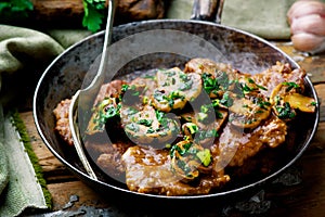 Mushroom Scaloppine in frying pam . . selective focus