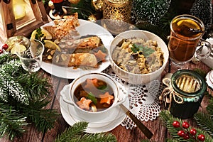 Mushroom soup, fried carp, sauerkraut with mushrooms for traditional Polish Christmas Eve's supper