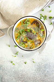 Mushroom soup with greens and processed cheese