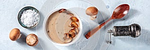 Mushroom soup ingredients in the kitchen, overhead flat lay panorama