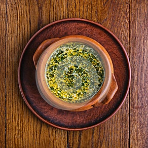 Mushroom soup in a pot. The dish is cooked in the restaurant photo