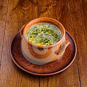 Mushroom soup in a pot on a table photo