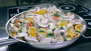 Mushroom and vegetable mix cooking on a pan.