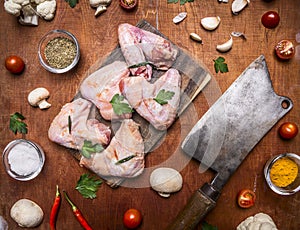 Mushrooms onions and salt and garlic on a cutting board meat cleaver rustiÑ wooden background close up