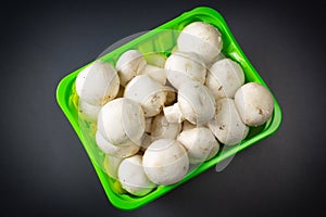 Mushrooms in packing on a dark background