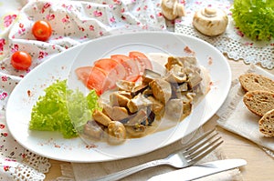 Mushrooms with sauce on the white plate