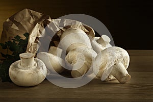 Mushrooms spilling from paper bag