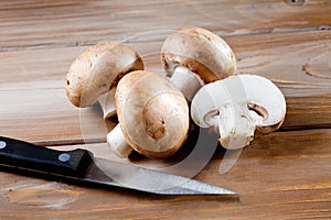 Mushrooms on wood, knive, chopped