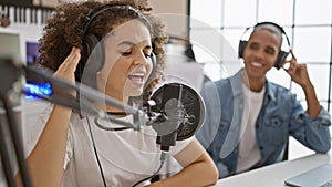 Music artists, enthralling melody of happy musicians singing, dancing and playing in music studio