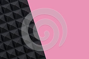 Music background of acoustic foam panel on pink copy space
