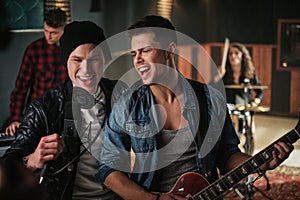 Music band having rehearsal in a studio photo