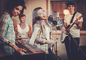 Music band performing in a studio