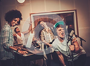 Music band performing in a studio