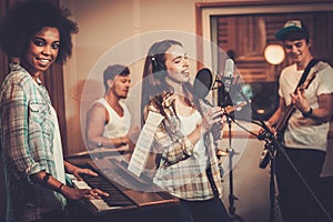 Music band performing in a studio