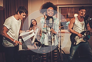 Music band performing in a studio