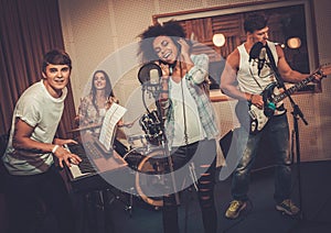 Music band performing in a studio photo