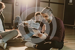 music band writing lyrics together while sitting