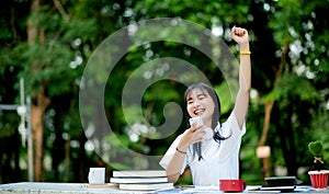 music. A beautiful woman with headphones is relaxing on her desk. smile and meditate meditation She is listening to