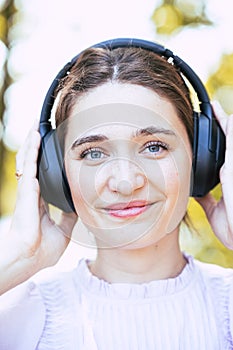 Music Bliss: Woman with Headphones in Nature