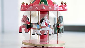 Music box horse white merry go round red carousel horses toy closeup