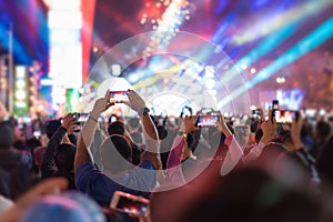 Music brand showing on stage or Concert Live and Defocused entertainment concert lighting on stage with Laser rays beams, party