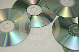 Music CDs and DVDs in a pile while shining