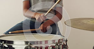 Music, closeup and hands of person with drums for practice, rocker and hobby performance. Audio, show and talent with