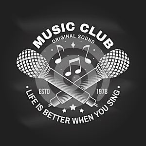 Music club logo, badge, label on chalkboard. Retro poster, banner with microphone, vintage typography design for t shirt