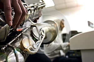 Music Concept. Closeup of Hands of Saxophone Player Playing on Saxophone Against White.Horizontal Image