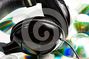 Music concept - headphones and audio cds