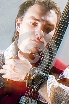 Music Concepts.Closeup Portrait of Young Male Guitar Player Posi