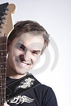 Music Concepts and Ideas. Portrait of caucasian Male Guitar Player Posing With Instrument