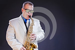 Music Concepts. Portrait of Caucasian Mature Male Saxophone Player