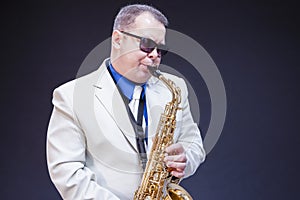 Music Concepts. Portrait of Expressive Playing Mature Male Saxo Player