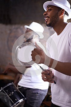 Music, concert and man with tambourine, percussion instruments and band mate on stage in Sao Paulo. Happy black men