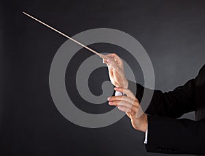 Music conductor with a baton