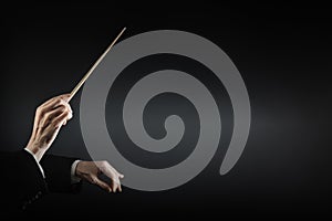 Music conductor hands with baton