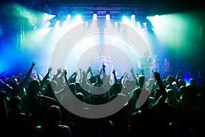 Music, dance and party with crowd at concert for rock, live band performance and festival show. New year, celebration