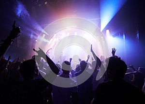 Music, dance and party with crowd at concert for rock, live band performance and festival show. New year, celebration