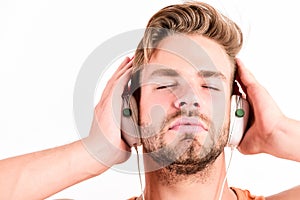 Music fan concept. It is great time to be creating new realities. Man handsome bearded guy listening music headphones