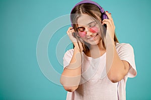 Music female fan is listening for music composition with closed eyes