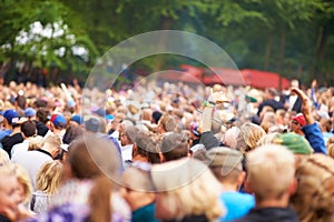 Music festival, crowd and outdoor dancing for celebration event party, listening disco in nature forest. People, concert