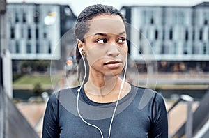 Music, fitness and face of black woman in city for wellness, healthy body and cardio workout in urban town. Sports