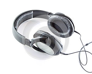 Music grey headphones with cable isolated on a white background