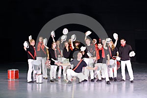 Music group of drummers in costumes with hats photo