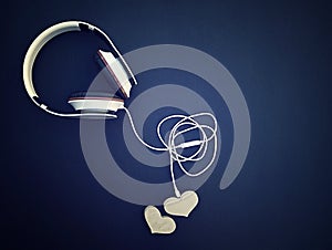 Music of hearts. Listen to your heart.  heart with headphones on dark background. Love listening to music