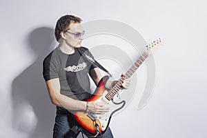 Music Ideas and Concepts. Male Guitar Player Posing With Guitar