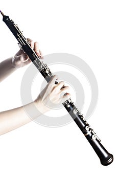 Music instrument oboe with hands close up